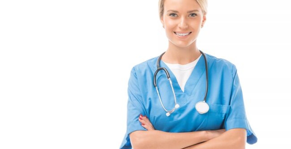 Happy young nurse with crossed arms looking at camera 