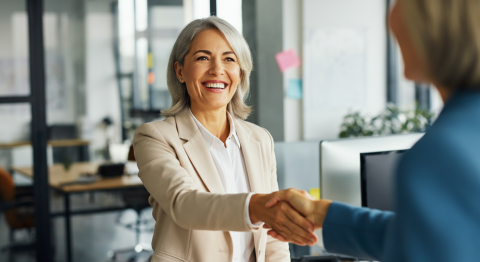 Woman shaking hands in office
