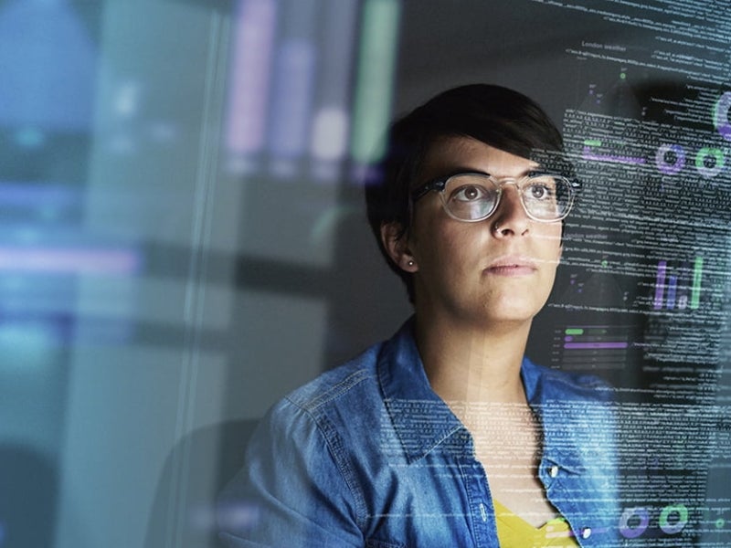 Cropped shot of a young lady looking through data.